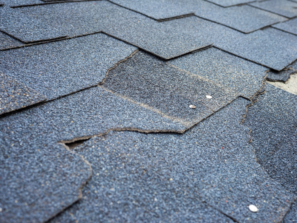 cracked shingle broken shingle replacement roofer elmer's roofing *c
